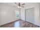 Charming bedroom featuring gorgeous floors, a closet, and plenty of natural light from a bright window at 22943 Sills Loop, Land O Lakes, FL 34639