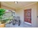 Cozy front porch with seating, perfect for relaxing and enjoying the neighborhood at 22943 Sills Loop, Land O Lakes, FL 34639