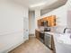Spacious kitchen with stainless steel appliances and granite countertops offers style and functionality at 22943 Sills Loop, Land O Lakes, FL 34639