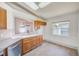 Bright kitchen with a window and skylight above the sink and countertops offers ample natural light at 22943 Sills Loop, Land O Lakes, FL 34639