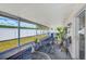 Covered lanai featuring lovely tile flooring, with a view of a fenced yard, perfect for relaxation at 22943 Sills Loop, Land O Lakes, FL 34639