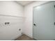 The laundry room features a tile floor, a door to the outside, and a wire rack shelf at 22943 Sills Loop, Land O Lakes, FL 34639