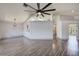 Open living space with modern flooring, neutral walls, and access to other areas of the home at 22943 Sills Loop, Land O Lakes, FL 34639