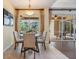 Bright breakfast nook with a view of the screened lanai and backyard at 2354 Messenger Cir, Safety Harbor, FL 34695