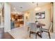 Open breakfast nook next to the kitchen featuring modern decor and plenty of natural light at 2354 Messenger Cir, Safety Harbor, FL 34695