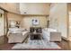 Well lit living room with neutral colored walls and furniture, hardwood floors, and an upstairs landing at 2354 Messenger Cir, Safety Harbor, FL 34695