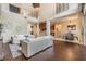 Spacious living room with high ceilings, hardwood floors, neutral furniture, and an open layout at 2354 Messenger Cir, Safety Harbor, FL 34695