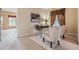 A home office with two chairs, a table, a modern lamp, and window with attractive draperies at 2354 Messenger Cir, Safety Harbor, FL 34695
