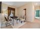 A home office with two chairs, a table, a modern lamp, and window with attractive draperies at 2354 Messenger Cir, Safety Harbor, FL 34695