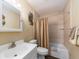 Well-maintained bathroom with a bathtub, shower, and vanity with sink at 2597 Countryside Blvd # 210, Clearwater, FL 33761