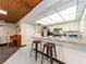 Another view of the large community kitchen featuring lots of prep space and seating at 2597 Countryside Blvd # 210, Clearwater, FL 33761