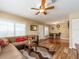 Living room flowing into dining area; features stylish furniture and wood-look floors at 2597 Countryside Blvd # 210, Clearwater, FL 33761