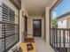Covered patio featuring dark accents and offering views of the community at 2597 Countryside Blvd # 210, Clearwater, FL 33761
