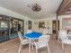 Poolside seating area with shade, offering a comfortable and relaxing gathering spot at 2597 Countryside Blvd # 210, Clearwater, FL 33761