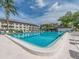 Another view of community swimming pool with ample lounging and relaxing space at 2597 Countryside Blvd # 210, Clearwater, FL 33761
