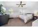 Bright bedroom with carpet, light gray walls, and a neutral-toned bed with a large window at 2816 Grand Kemerton Pl, Tampa, FL 33618