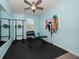 Gym with a mirror, weights, exercise bands, pull up bar and a bench at 2816 Grand Kemerton Pl, Tampa, FL 33618