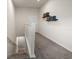 Carpeted hallway with a staircase and floating book shelves, illuminated by a ceiling light at 2816 Grand Kemerton Pl, Tampa, FL 33618