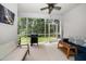 Screened lanai provides shade and a view of the lush backyard landscaping at 2816 Grand Kemerton Pl, Tampa, FL 33618