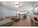 Open concept living space with tile floors and view into the modern kitchen at 2816 Grand Kemerton Pl, Tampa, FL 33618