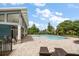 Resort-style pool area with ample seating and lush landscaping, perfect for relaxation at 2816 Grand Kemerton Pl, Tampa, FL 33618