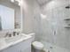 Bright bathroom featuring a glass-enclosed shower, modern sink, and stylish tile work at 2890 Alexandria Marie Ln, Lutz, FL 33559