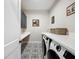 Laundry room featuring modern washer and dryer and tile floors at 2890 Alexandria Marie Ln, Lutz, FL 33559