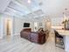 Bright living room featuring coffered ceilings, hardwood floors, and open floor plan at 2890 Alexandria Marie Ln, Lutz, FL 33559