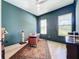 Stylish office with dark walls, a modern desk, and large windows offering plenty of natural light at 2890 Alexandria Marie Ln, Lutz, FL 33559