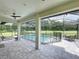 Spacious outdoor patio area with a screened pool and ample room for seating and dining at 2890 Alexandria Marie Ln, Lutz, FL 33559