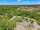 Aerial view of complex highlighting lush landscaping, ample parking, and serene surroundings at 2919 Fig Ct, Palm Harbor, FL 34684