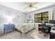 This bedroom features a desk, and a ceiling fan at 2919 Fig Ct, Palm Harbor, FL 34684