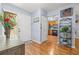 Inviting foyer with hardwood floors, leading to the kitchen with stainless steel appliances at 2919 Fig Ct, Palm Harbor, FL 34684