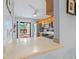 Modern kitchen with granite counters, stainless steel appliances, and a view of the breakfast nook at 2919 Fig Ct, Palm Harbor, FL 34684
