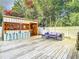 Backyard oasis featuring an outdoor bar, stylish seating, and a spacious wooden deck at 2928 W Arch St, Tampa, FL 33607