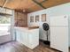 The bar area features a ceiling fan, vintage decor and access to an outdoor deck at 2928 W Arch St, Tampa, FL 33607