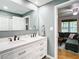 Well-lit bathroom featuring double sinks and granite countertops at 2928 W Arch St, Tampa, FL 33607