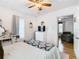 Bright bedroom with a ceiling fan and a view into another room at 2928 W Arch St, Tampa, FL 33607