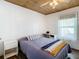 This bedroom features a ceiling fan, wood-look floors and a built in desk at 2928 W Arch St, Tampa, FL 33607