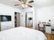 Cozy bedroom with a ceiling fan and a desk area at 2928 W Arch St, Tampa, FL 33607