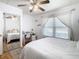 This bedroom features a ceiling fan, wood floors and a built in desk at 2928 W Arch St, Tampa, FL 33607