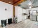 Eat-in kitchen, featuring updated white cabinets, stainless appliances, and lots of space at 2928 W Arch St, Tampa, FL 33607