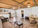 Open-concept living room with wood floors, bar area, dining space and comfortable seating at 2928 W Arch St, Tampa, FL 33607