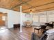 Bright living room featuring wood floors, a dining area and comfortable rattan seating at 2928 W Arch St, Tampa, FL 33607