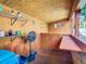 Outdoor bar area featuring custom woodwork, ample shelving, and a cozy atmosphere at 2928 W Arch St, Tampa, FL 33607