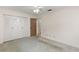 Spacious room with closet, ceiling fan and neutral walls to create a relaxing and adaptable living area at 2956 Sutherland Ct, Palm Harbor, FL 34684