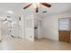 Eat-in kitchen with laundry area and white appliances including refrigerator, stove, and microwave at 2956 Sutherland Ct, Palm Harbor, FL 34684