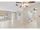 Tiled open living space with natural light and access to other rooms creates an inviting and functional layout at 2956 Sutherland Ct, Palm Harbor, FL 34684