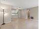 Inviting open living area with tile floors and a ceiling fan, perfect for Gathering gatherings and relaxation at 2956 Sutherland Ct, Palm Harbor, FL 34684