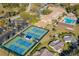 Aerial view of the community tennis courts with well-maintained courts and surrounding landscape at 2956 Sutherland Ct, Palm Harbor, FL 34684